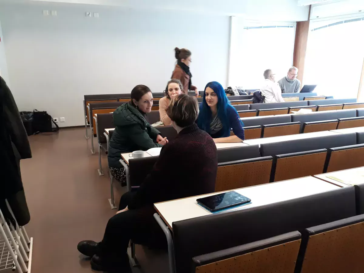 Workshop attendants discussing among one another.