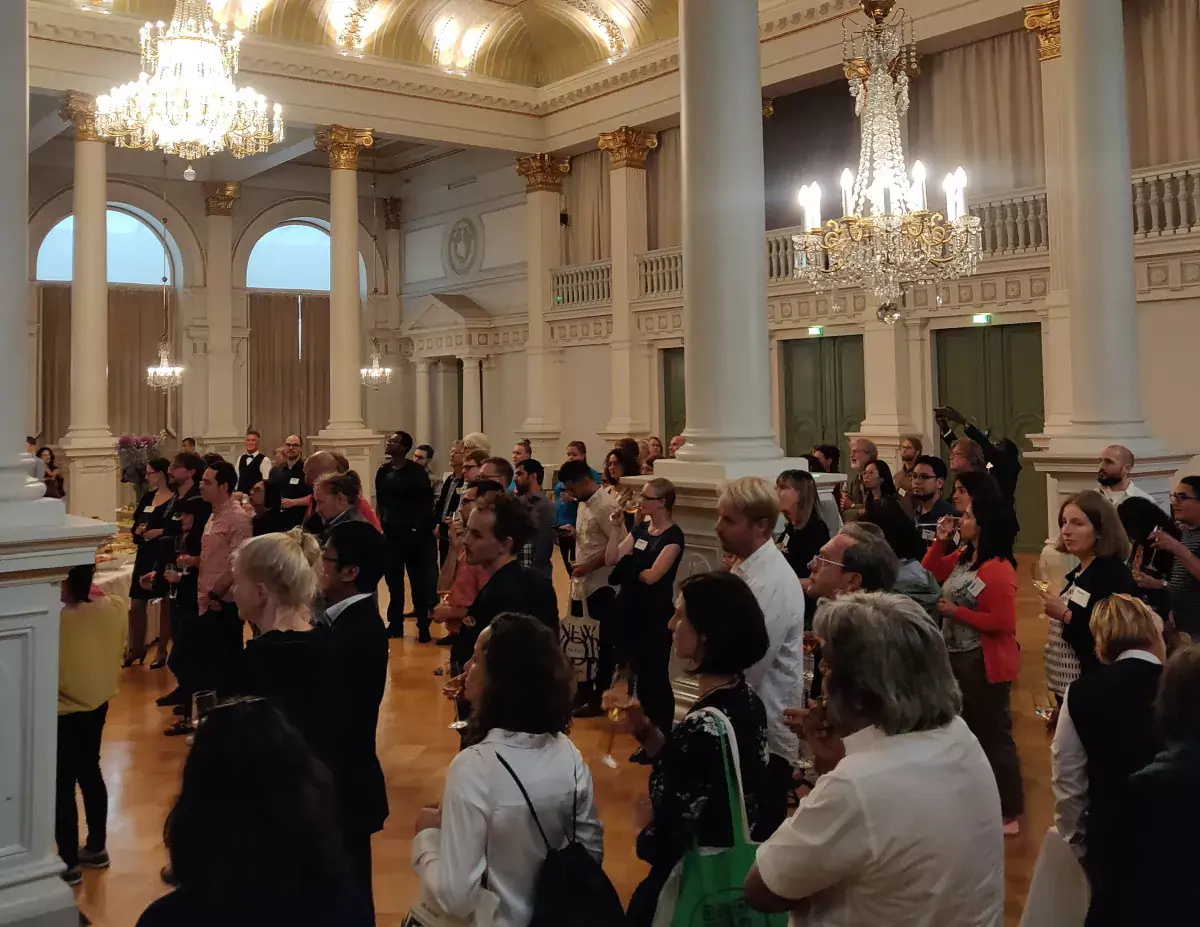 WERN2018 participants listen to the greeting of one of Helsinki's deputy mayor at the City Reception.